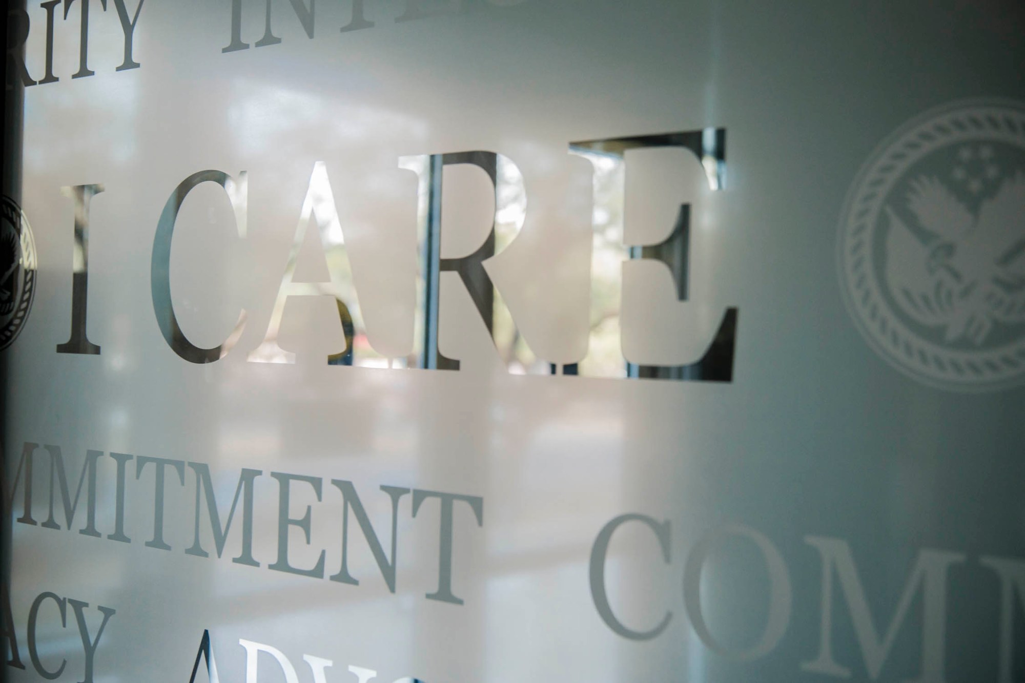 I CARE wording etched in glass.